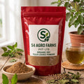 Red package of S4 Agro Farms Tulsi leaves powder on a wooden surface with a glass of tea and herbs.
