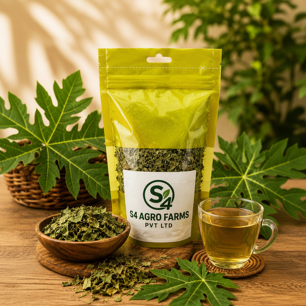 Packaged green herbs with S4 Agro Farms Pvt Ltd label, bowl of herbs, glass of tea, and leaves on a wooden surface.